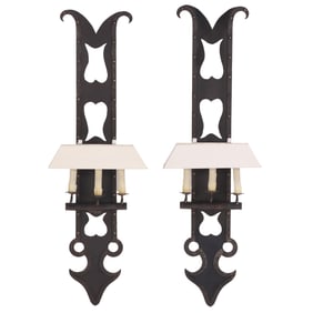 LARGE PAIR OF IRON WALL SCONCES IN THE MANNER OF PARZINGER.