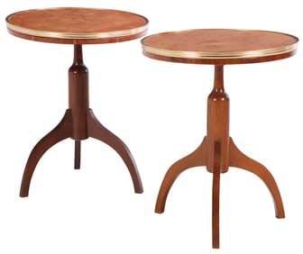 A PAIR OF MAHOGANY SIDE TABLES HAVING BRASS TRIM BURL WOOD TOPS AND RESTING ON TRIPOD LEGS.