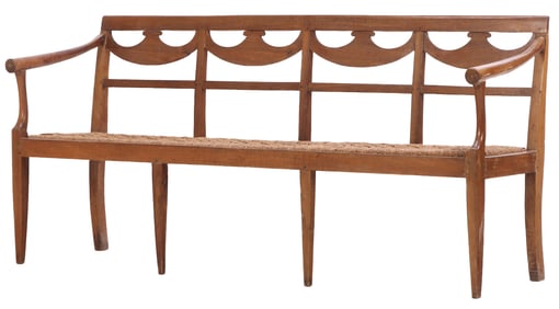 ITALIAN WALNUT LATE EIGHTEENTH CENTURY DIRECTOIRE BENCH HAVING A CORD SEAT AND OPEN ARMS.