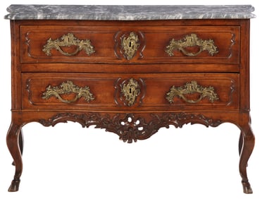 FRENCH REGENCE STYLE CARVED WALNUT MARBLE TOP COMMODE HAVING HOOVED FEET AND TWO DRAWERS.