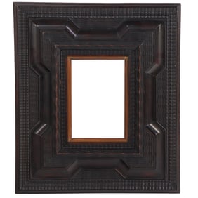 LATE NINETEENTH CENTURY RIPPLE CARVED DUTCH FRAME HAVING A WIDE BORDER.