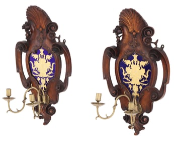 A PAIR OF NINETEENTH CENTURY  WALNUT WALL SCONCES HAVING HERALDIC DECORATED GLASS PANELS WITH