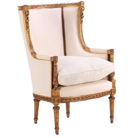 FRENCH CARVED AND GILTWOOD LOUIS XVI STYLE BERGERE CHAIR WITH NEW FABRIC C 1910.