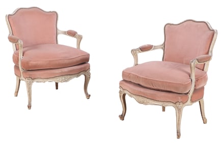 A PAIR OF CARVED AND PAINTED LOUIS XV STYLE FAUTEUILS HAVING BRASS STUD DECORATED UPHOLSTERY