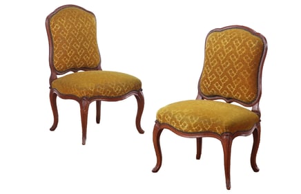 LARGE SCALE PAIR OF FRENCH EIGHTEENTH CENTURY CARVED WALNUT LOUIS XV SIDE CHAIRS.