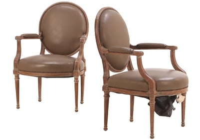 A PAIR OF  LOUIS XVI STYLE CERUSED OAK OPEN ARM LIBRARY CHAIRS HAVING LEATHER UPHOLSTERY C 1900.