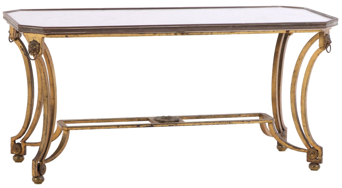 GILT IRON MARBLE TOP COFFEE TABLE IN THE MANNER OF JANSEN C 1940 HAVING A STRETCHER BASE AND BRASS: Gilt iron marble top coffee table in the manner of Jansen C 1940 having a stretcher base and brass bound top. Ht: 19.5" Wd: 40" Dpth: 16.5"