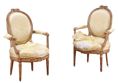 A PAIR OF FRENCH LOUIS XVI OPEN ARM CHAIRS PURCHASED BY MGM IN 1930S AND USED IN OVER 40 FILMS