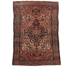 AN ANTIQUE SAROUK RUG 4'2" x 6'3"