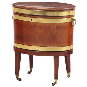 GEORGE III MAHOGANY CELLERETTE HAVING OVAL FORM AND BRASS BANDS C. 18-19TH CENTURY