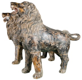 A PAIR OF ASIAN LIFE SIZED POLYCHROMED WOODEN STATUES OF LIONS.