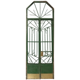 A PAIR OF ART DECO IRON GATES WITH TRANSOM AND FRAME C 1930.