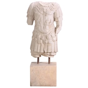 CARVED MARBLE TORSO RESTING ON A SOLID MARBLE PLINTH.