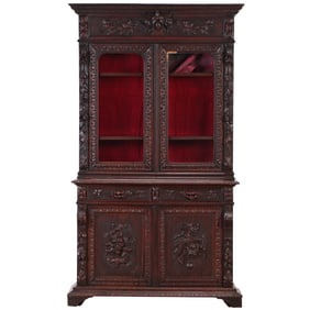 CONTINENTAL TWO PART CARVED OAK CABINET WITH RELIEF CARVED PANELS C 1880.