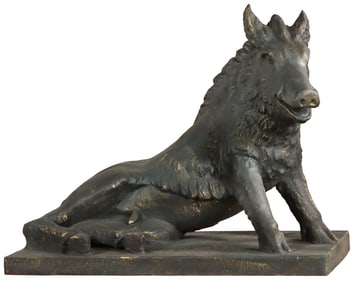 A CAST IRON GARDEN SCULPTURE OF A BOAR IN REPOSE AFTER THE ANTIQUE.