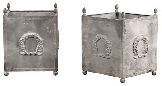 PAIR OF ENGLISH STYLE IRON PLANTERS HAVING A LEAD WASH AND WREATH DECORATION.