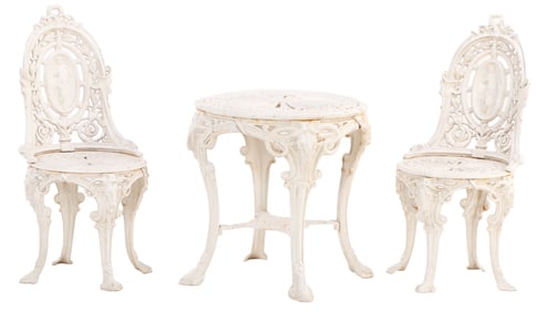 THREE PIECE CAST IRON ROCOCCO STYLE TABLE AND CHAIRS HAVING RAMS HEAD AND FIGURAL DECORATION.