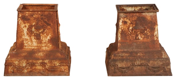 PAIR OF CAST IRON BASES WITH RAISED DECORATION.