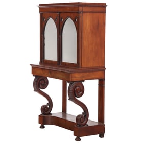 TWO PART GOTHIC STYLE MAHOGNAY CABINET ON STAND HAVING A SINGLE DRAWER C 1860.