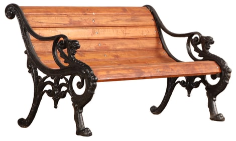 CAST IRON AND WOOD PARK BENCH HAVING GRIFFIN FORM ENDS.