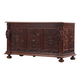 FIGURAL CARVED OAK WRITING DESK C 1880 HAVING A LEATHER TOP AND A FULLY CARVED BACK SIDE.