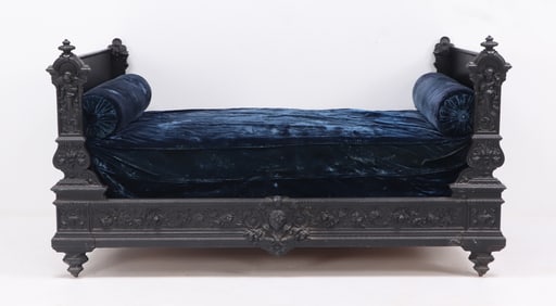 FRENCH CAST IRON DAYBED C 1860 WITH WINGED CHERUBS AND FLORAL DETAILS IN HIGH RELIEF.