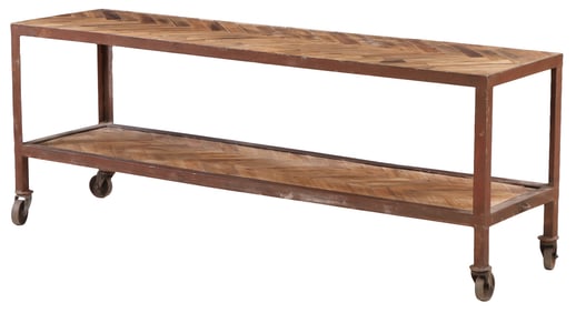 INDUSTRIAL IRON TWO TIER CONSOLE TABLE ON WHEELS HAVING A PARQUET WOOD TOP.