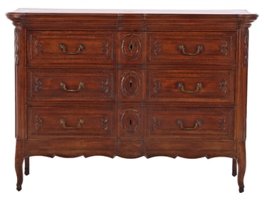 EIGHTEENTH CENTURY CARVED OAK FRENCH COMMODE HAVING THREE DRAWERS.