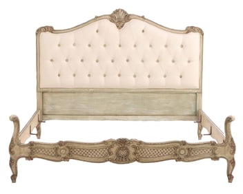 FULL SIZE PAINTED AND CARVED WOOD BED C 1940 IN THE LOUIS XV STYLE HAVING NEW BUTTON UPHOLSTERY.