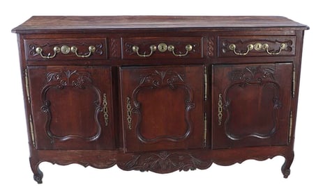 FRENCH OAK LOUIS XV SIDEBOARD HAVING THREE DRAWERS OVER THREE DOORS C 1800.