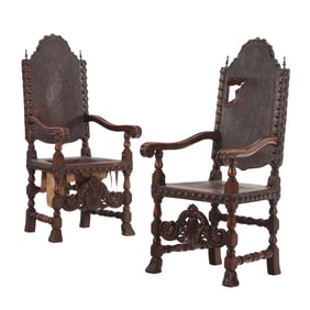 OVERSIZED PAIR OF NINETEENTH C CARVED WALNUT, LEATHER AND BRASS STUDS OPEN ARM CHAIRS.