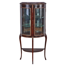 FRENCH MAHOGANY BRONZE MOUNTED VITRINE HAVING CURVED GLASS PANELS AND A SINGLE DOOR C 1900.