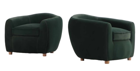 A PAIR OF MODERN VELVET UPHOLSTERED CLUB CHAIRS HAVING CONTINUOUS ARMS AND BLONDE WOOD FEET.