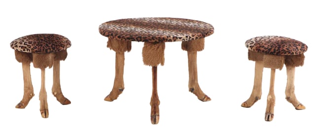 THREE PIECE TABLE AND STOOL SET COMPRISED OF DEER FEET, WOOD AND FAUX LEOPARD FARBRIC.