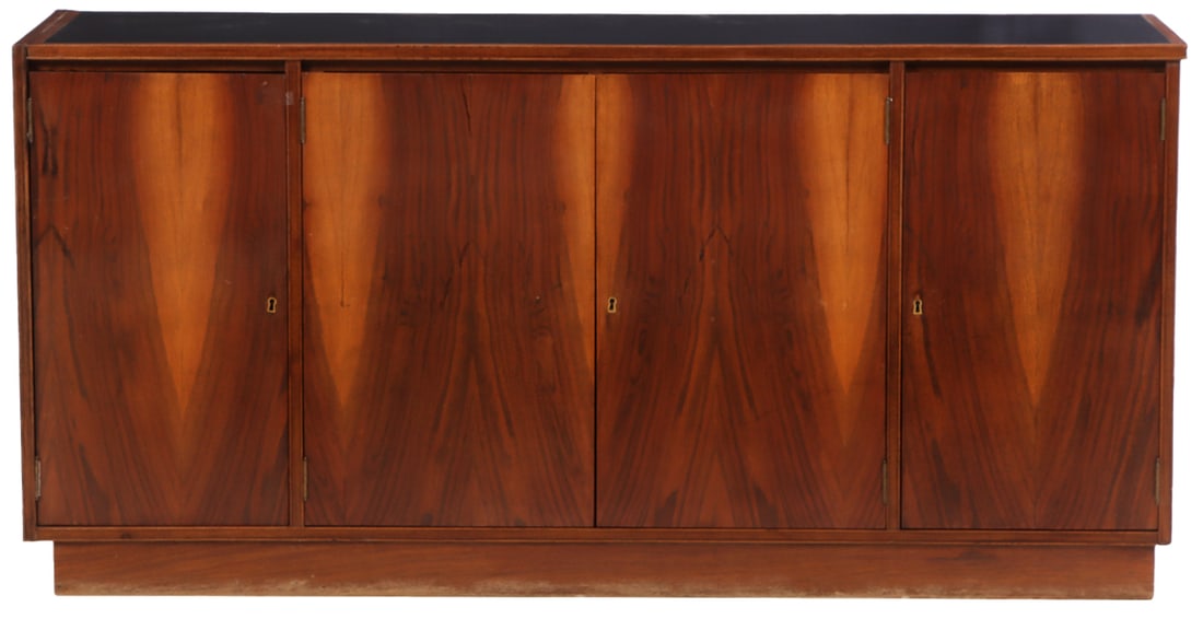 FOUR DOOR ROSEWOOD SIDEBOARD WITH INTERIOR DRAWERS AND AN INSET BLACK LAMINATE TOP C 1965. (1 of 6)