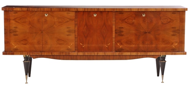 AN EXOTIC FIVE DOOR WALNUT SIDEBOARD HAVING BOOKMATCHED VENEER, EBONIZED LEGS, SYCAMORE