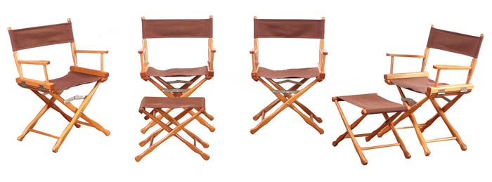 FOUR CAMPAIGN STYLE FOLDING CHAIRS ALONG WITH TWO MATCHING STOOLS.
