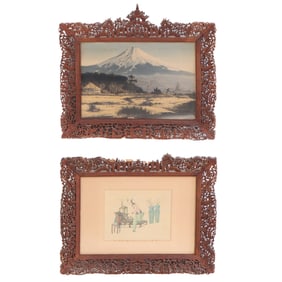 PAIR CHINESE CARVED PICTURE FRAMES WITH DRAGONS AND FIGURES, HOUSING ASIAN PRINTS. C. 1920S.