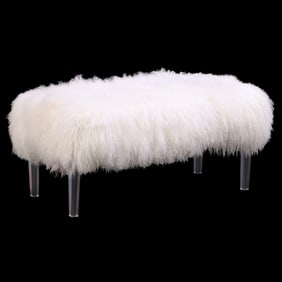 A LUCITE BENCH HAVING FAUX SHAG UPHOLSTERY.