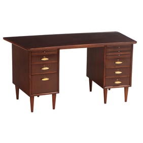 MAHOGANY WRITING DESK HAVING A SHAPED TOP AND PULL OUT WRITING SLIDE C 1950.