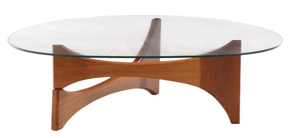 A GLASS TOP AND WOOD COFFEE TABLE IN THE MANNER OF ISAMU NOGUCHI.