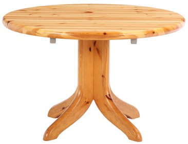 A BRUTALIST STYLE PINE PEDESTAL TABLE C 1975 HAVING TWO ORIGINAL LEAVES.