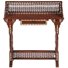 A PETITE SYRIAN WRITING DESK OR OCCASIONAL TABLE HAVING TURNED SPINDLES AND FAUX IVORY INLAY FRONT