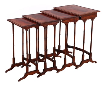 EDWARDIAN MAHOGANY NEST OF FOUR TABLES HAVING OVAL PANELS OF CROTCH MAHOGANY INSET INTO THE TOPS C