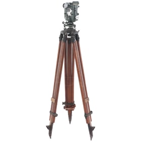 IRON TRANSIT ON ADJUSTABLE WOOD TRIPOD BASE.