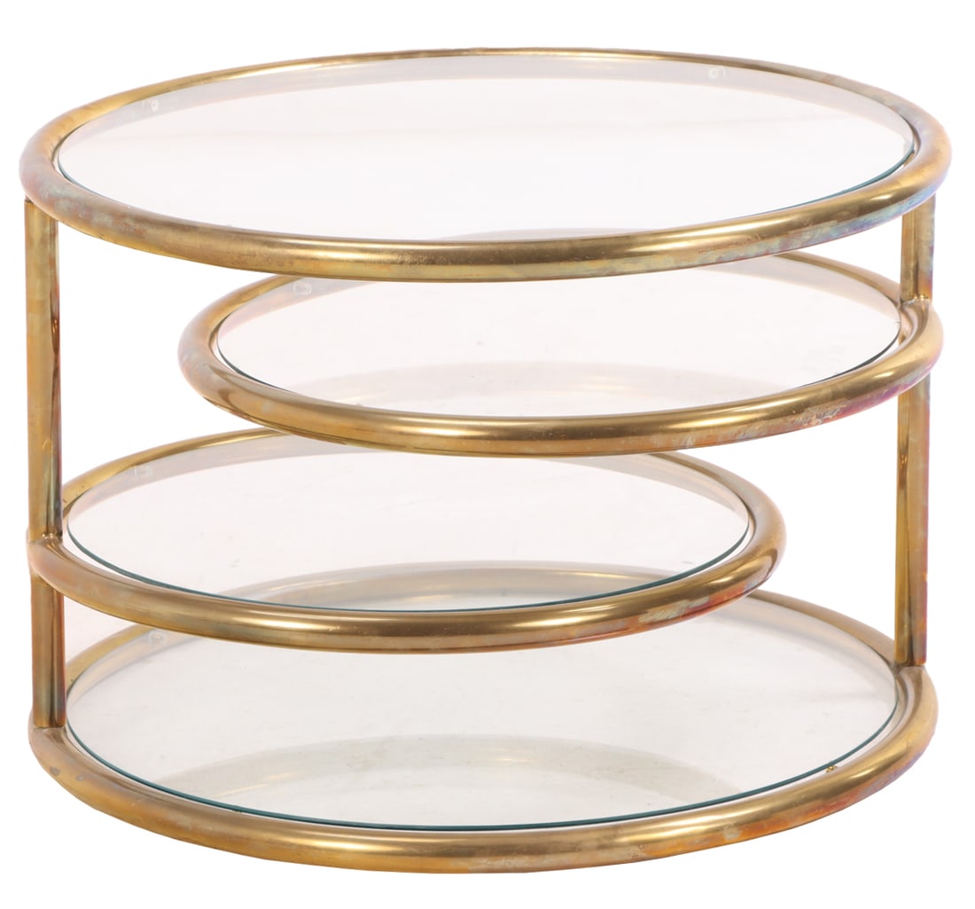A ROUND BRASS AND GLASS COFFEE TABLE HAVING TWO SWING OUT SHELVES C 1970. (1 of 5)