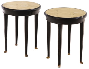 A PAIR OF ROUND EBONIZED END TABLES HAVING GOLD GILT GLASS TOPS, INSET BRASS BEADING  AND BRASS