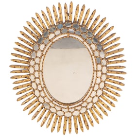 A SPANISH STYLE CARVED AND GILTWOOD STARBURST MIRROR CIRCA 1970