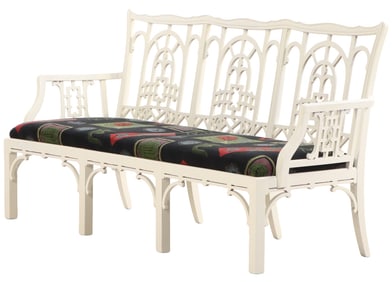 A PAINTED CHINESE CHIPPENDALE STYLE TRIPLE BACK OPEN ARMS SETTEE HAVING MODERN FABRIC.