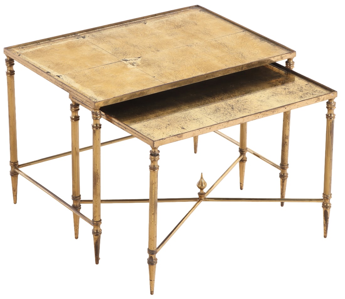 A SET OF FRENCH BRASS NESTING TABLES HAVING GOLD GILT GLASS TOPS IN THE MANNER OF JANSEN CIRCA: A set of French brass nesting tables having gold gilt glass tops in the manner of Jansen circa 1950. Low table- Ht: 13" Wd: 17.75" Dpth: 12" Ht: 14.25" Wd: 19.25" Dpth: 14"